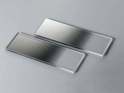 Linear variable neutral density filter is used to attenuate light as the filter is shifted. The filter can be used for white light as well as for lasers. A large finite aperture can be attenuated by translating two filters in opposite derections..