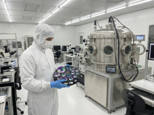 optical_coating_facility_cleanroom_with_technician