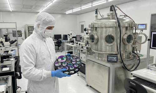 optical_coating_facility_cleanroom_with_technician